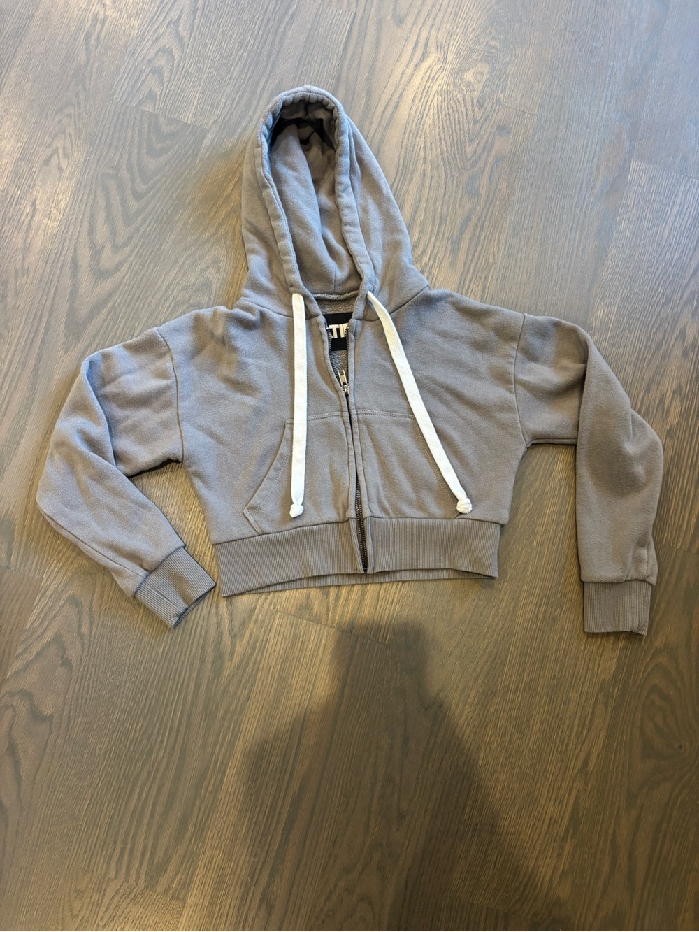 Katie J NYC Cropped Hooded Zip Sweatshirt in Gray with White Drawstrings